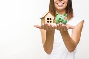 smiley-woman-holding-wooden-cottage-piggy-back (1)